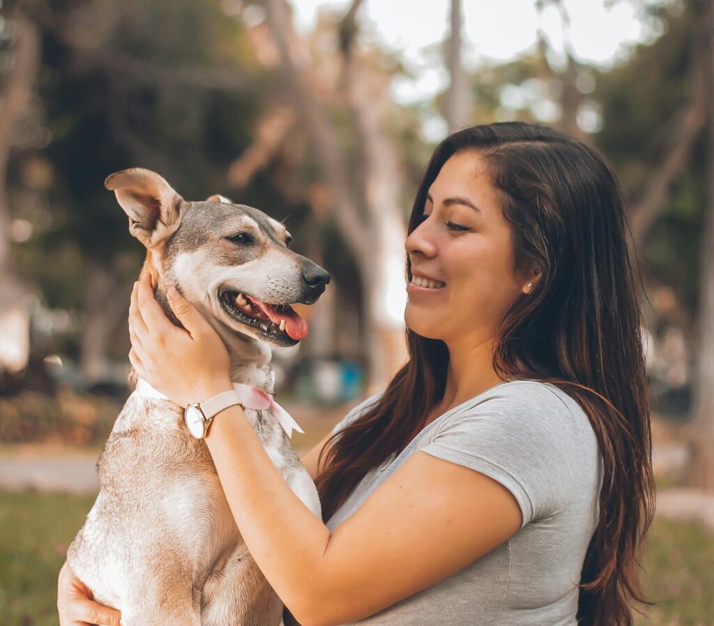 Pet owner caring for a companion animal with kindness and responsible care